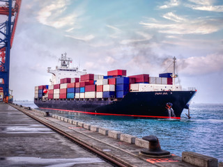 The container vessel departure from port of Thailand after completed loading.