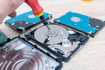 Naklejka premium old broken hard disk drives composition in a repair recovery service