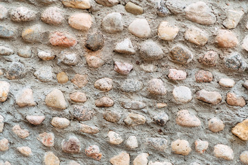 Neatly folded stone wall seamless texture background, old castle brick wall