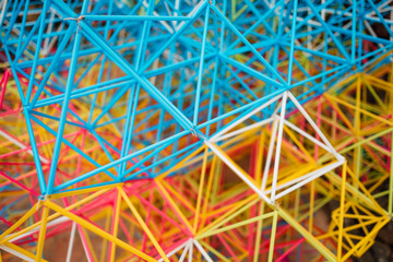 abstract colorful shapes from plastic sticks