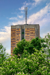 modern apartment building with mobile communications antenna