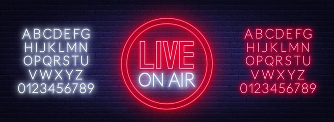 Live on air glowing sign on brick wall background. Template for design. Neon alphabet .