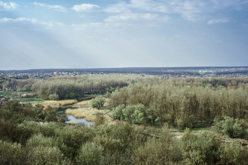 Fototapeta na wymiar Landscape from height on green steppes. Motherland of famous painter Repin