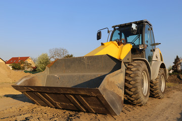 Wheel loader at sunset, close up