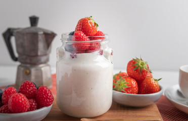 yogurt with fruit on a breakfast table
