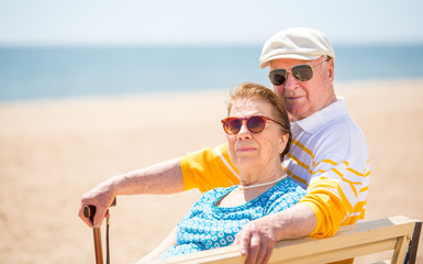 family, age, travel, tourism and people concept - Senior couple rest at tropical resort near sea