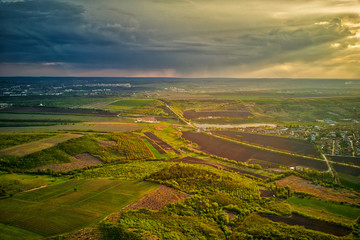 Flight over cultivating field in the spring at sunset. Moldova Republic of.