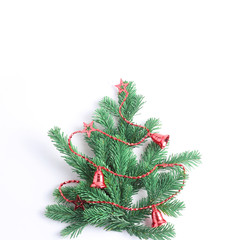 Decorative Christmas tree decorated with red beads. Flat lay, minimal concept, square frame
