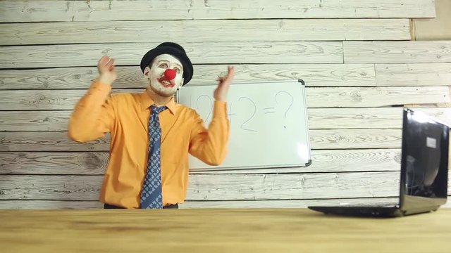 Clown businessman working in the office