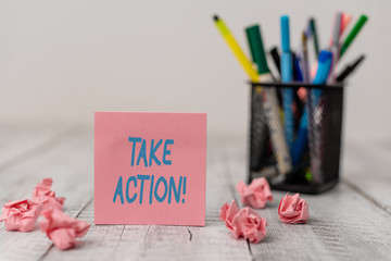 Text sign showing Take Action. Business photo text do something official or concerted to achieve aim with problem Set of plain note paper with scraps and stationary on the wooden table