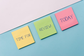 Text sign showing Time For Review. Business photo showcasing formal assessment of something with intention instituting change Pastel colour note papers placed sideways on the of softhued backdrop