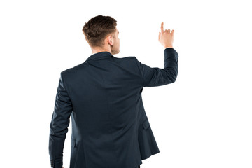 back view of businessman in suit pointing with finger while standing isolated on white