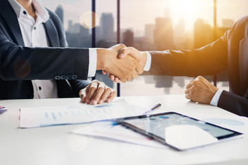 successful cooperation and confident partner concept, business people shake hands with customer