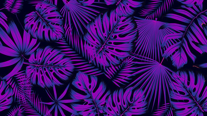 Trendy seamless tropical pattern with exotic leaves in ultraviolet light