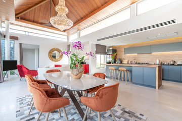 interior design in living room and open kitchen area with dining table