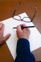 Calculus problem being worked out to find a solution with paper and pencil