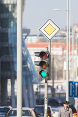 Traficlight green on the background of blurred city