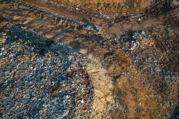 Aerial top down view of city garbage dump. Pile of plastic trash, food waste, landfill
