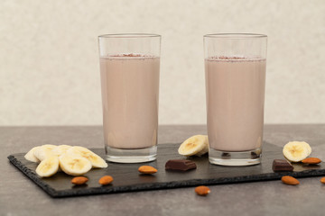 Healthy Chocolate Protein Shake with Almond Milk, banana, chocolate and nuts. Milkshake. Tasty and healthy Breakfast 