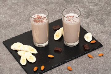 Healthy Chocolate Protein Shake with Almond Milk, banana, chocolate and nuts. Milkshake. Tasty and healthy Breakfast 