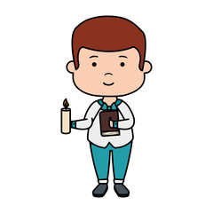 little boy with bible and candle first communion