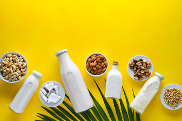 many kinds of vegetable milk in glass jars