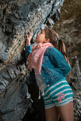  girl on the trip admires the rocks in the caves