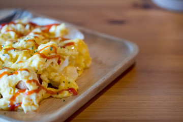 Scrambled eggs on buttered toast.