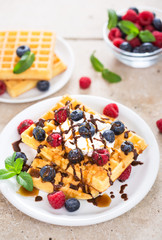 Fresh homemade waffles with blueberries and raspberries 