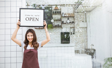 Startup successful small business owner sme beauty girl stand hand hold open sign coffee shop or...