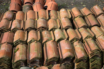 heap of old and new roof tiles