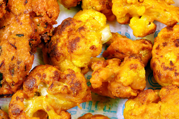 Battered deep fried cauliflower pakora piaju