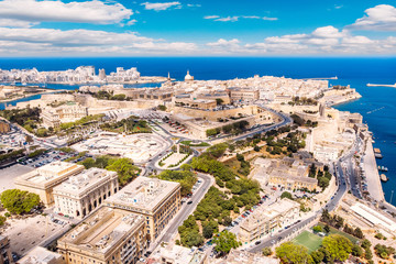 Fototapeta na wymiar Valletta capital city of Malta. Panorama port and blue sea. Aerial top view