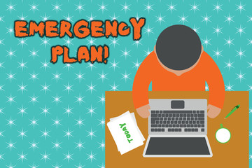 Handwriting text Emergency Plan. Conceptual photo actions developed to mitigate damage of potential events Upper view young man sitting working table laptop documents coffee cup pen