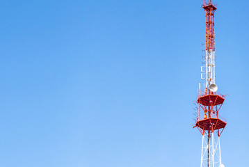 4G TV radio tower with parabolic antenna and satellite dish. Broadcast network signal. High...