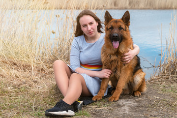 Girl with a dog in the park.