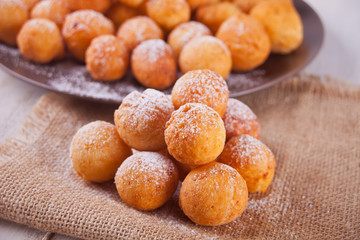 Small balls of freshly baked homemade cottage cheese doughnuts
