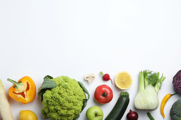 Flat lay composition with fresh ripe vegetables and fruits on white background