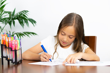 Cute Girl Sitting at his Desk Painting