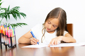 Cute Girl Sitting at his Desk Painting