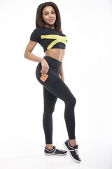 Fototapeta na wymiar Fitness woman in black sports clothes isolated on white