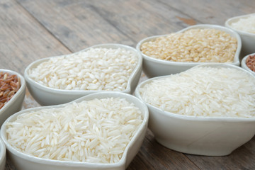 Different rice on ceramic bobowl ot the table