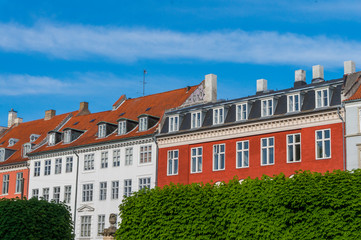 Scenic summer view of the ancient classic colorful houses with blue sky in Copenhagen, Denmark