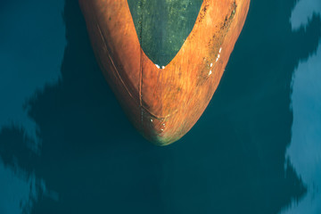 Bulbous bow of the warship sailing in the deep blue sea created laminar flow.