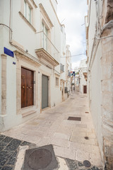 Fototapeta na wymiar View of the old town of Martina Franca with a beautiful houses painted in white.