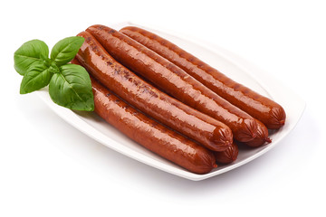 Grilled Pork Sausages with basil leaves, close-up, isolated on white background