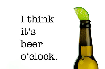 An isolated brown beer bottle with a refreshing slice of lime and the quote 