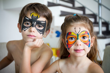 boy and girl with face painted