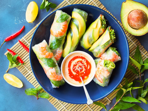 Fresh summer rolls with shrimp and avocado, Vietnamese food in top view for a healthy appetizer.