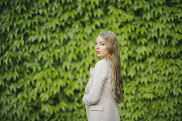 Fototapeta premium Twin Russian Girl walking in Day on a Luxury Park